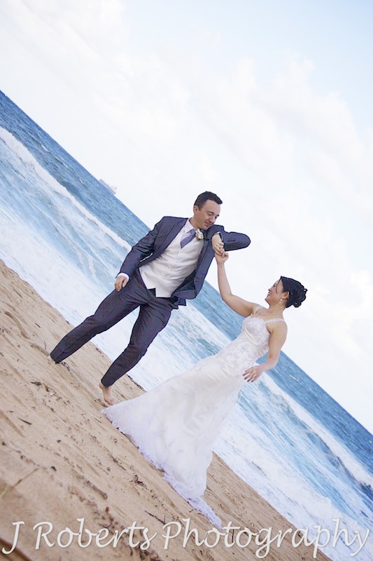 Bridal couple dancing on the beach - wedding photography sydney